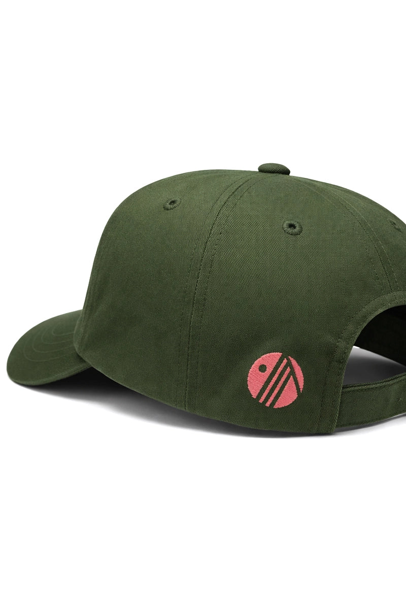 Green cap with a pink logo on a white background